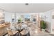 Bright dining area with glass table and seating at 7 Elgin Pl # 401, Dunedin, FL 34698