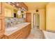Updated bathroom with double vanity, granite countertops, and mosaic tile at 700 Island Way # 504, Clearwater, FL 33767
