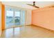 Bright bedroom with water views and sliding glass doors to balcony at 700 Island Way # 504, Clearwater, FL 33767