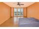 Bright bedroom with water views and sliding glass doors to balcony at 700 Island Way # 504, Clearwater, FL 33767