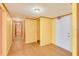 Light-colored hallway with wood flooring and multiple doors at 700 Island Way # 504, Clearwater, FL 33767