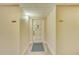 Residential hallway with neutral walls and elegant flooring at 700 Island Way # 504, Clearwater, FL 33767