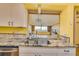 Kitchen with granite countertops and view of living room at 700 Island Way # 504, Clearwater, FL 33767