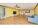 Bright living room with hardwood floors, and access to balcony at 700 Island Way # 504, Clearwater, FL 33767