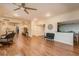 Open living area with hardwood floors and partial kitchen view at 700 Island Way # 504, Clearwater, FL 33767