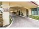 Covered parking with paver driveway and lush landscaping at 700 Island Way # 504, Clearwater, FL 33767