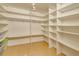 Spacious walk-in closet with ample shelving and hanging space at 700 Island Way # 504, Clearwater, FL 33767