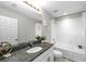 Clean bathroom with granite countertop and bathtub at 7014 Summer Holly Pl, Riverview, FL 33578