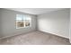 Simple bedroom with carpeted floor and window at 7014 Summer Holly Pl, Riverview, FL 33578