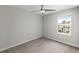 Simple bedroom with carpeted floor and a window at 7014 Summer Holly Pl, Riverview, FL 33578