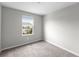 Empty bedroom with carpeted floor and window at 7014 Summer Holly Pl, Riverview, FL 33578