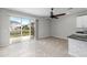 Bright dining area with tile floors and sliding glass doors leading to a patio at 7014 Summer Holly Pl, Riverview, FL 33578