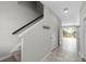 Spacious entryway with stairs and view into the living area at 7014 Summer Holly Pl, Riverview, FL 33578