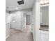 Hallway with carpet, doors to bedrooms and laundry at 7014 Summer Holly Pl, Riverview, FL 33578