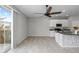 Modern kitchen with island, breakfast bar, and patio access at 7014 Summer Holly Pl, Riverview, FL 33578