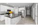 Modern kitchen with island, stainless steel appliances, and breakfast bar at 7014 Summer Holly Pl, Riverview, FL 33578