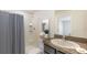 Clean bathroom with a shower/tub combination and granite vanity at 7812 Wheat Stone Dr, Zephyrhills, FL 33540