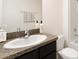 Clean bathroom with vanity, toilet and shower at 7812 Wheat Stone Dr, Zephyrhills, FL 33540
