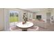 Open dining area with adjacent living room and view of backyard at 7812 Wheat Stone Dr, Zephyrhills, FL 33540