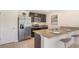 Eat-in kitchen with stainless steel appliances and granite countertops at 7812 Wheat Stone Dr, Zephyrhills, FL 33540