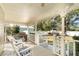 Spacious back porch with rocking chairs and a grill at 7312 7Th Nw Ave, Bradenton, FL 34209