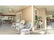 Relaxing back porch with rocking chairs and a swing at 7312 7Th Nw Ave, Bradenton, FL 34209