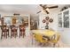 Cozy dining area with yellow table and built-in cabinetry at 7312 7Th Nw Ave, Bradenton, FL 34209