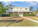 Two-story house with a wraparound porch and manicured lawn at 7312 7Th Nw Ave, Bradenton, FL 34209