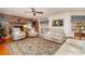 Living room with a fireplace and large windows for natural light at 7312 7Th Nw Ave, Bradenton, FL 34209