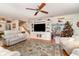 Spacious living room with a large TV and comfortable seating at 7312 7Th Nw Ave, Bradenton, FL 34209