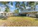 Spacious backyard with main house, shed, and detached garage at 7312 7Th Nw Ave, Bradenton, FL 34209