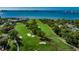 Aerial view of golf course with water features at 100 Oakmont Ln # 602, Belleair, FL 33756