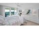 Bedroom with a queen-size bed and water view at 100 Oakmont Ln # 602, Belleair, FL 33756