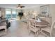 Bright dining area with seating for four near living room at 100 Oakmont Ln # 602, Belleair, FL 33756