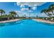 Resort-style pool with plenty of lounge chairs at 100 Oakmont Ln # 602, Belleair, FL 33756