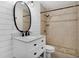 Updated bathroom with walk-in shower, built-in bench, and modern vanity at 10228 Oslin St, Tampa, FL 33615