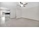 Open concept living room with kitchen view and tile floors at 10228 Oslin St, Tampa, FL 33615