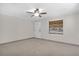 Bright and airy living room with tile floors and ceiling fan at 10228 Oslin St, Tampa, FL 33615