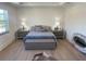 Spacious main bedroom with a plush bed and stylish decor at 1046 Bass Blvd, Dunedin, FL 34698