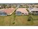 Aerial view of home with pool and landscaped yard, located in a quiet community at 10553 Bermuda Isle Dr, Tampa, FL 33647