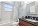 Bathroom with shower/tub combo, granite vanity at 10553 Bermuda Isle Dr, Tampa, FL 33647