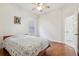 Bedroom with hardwood floors and ceiling fan at 10553 Bermuda Isle Dr, Tampa, FL 33647