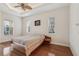 Bedroom with hardwood floors and ceiling fan at 10553 Bermuda Isle Dr, Tampa, FL 33647