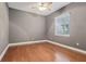 Bedroom with hardwood floors and ceiling fan at 10553 Bermuda Isle Dr, Tampa, FL 33647