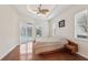 Bright bedroom with hardwood floors and access to a pool at 10553 Bermuda Isle Dr, Tampa, FL 33647