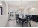 Elegant dining room with a large chandelier and dark wood table at 10553 Bermuda Isle Dr, Tampa, FL 33647