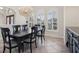 Formal dining room with chandelier and large windows at 10553 Bermuda Isle Dr, Tampa, FL 33647