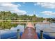 Wooden dock extending over calm lake water at 10553 Bermuda Isle Dr, Tampa, FL 33647