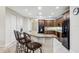 Kitchen with breakfast bar and dark wood cabinets at 10553 Bermuda Isle Dr, Tampa, FL 33647