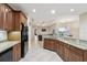 Spacious kitchen with granite countertops and dark wood cabinets at 10553 Bermuda Isle Dr, Tampa, FL 33647